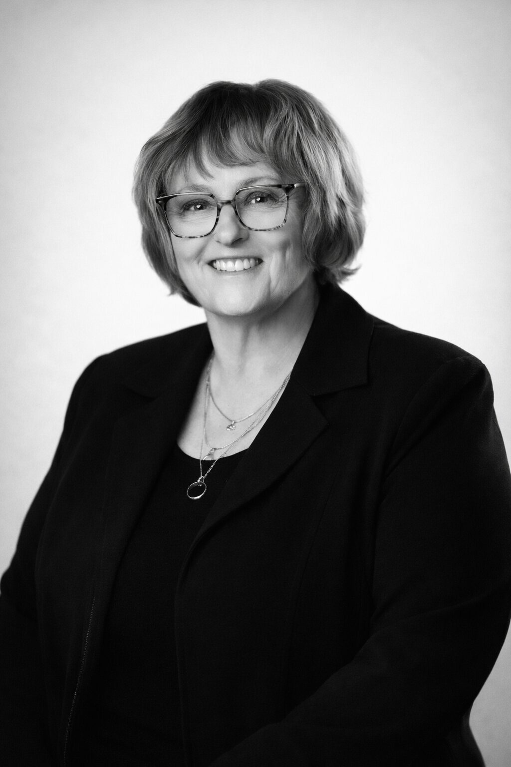 Greyscale headshot of Beth